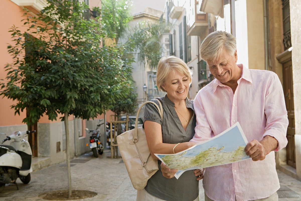 Mature,Couple,Visiting,Picturesque,City,Street,On,Holiday,,Reading,Map